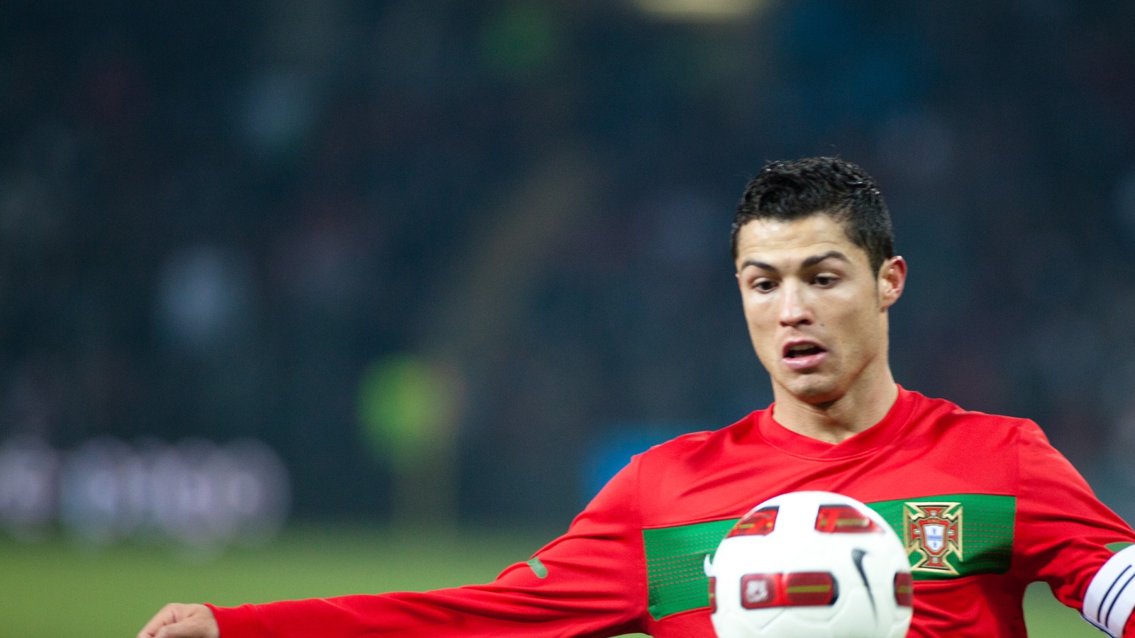 Cristiano Ronaldo playing for Portugal in a red shirt