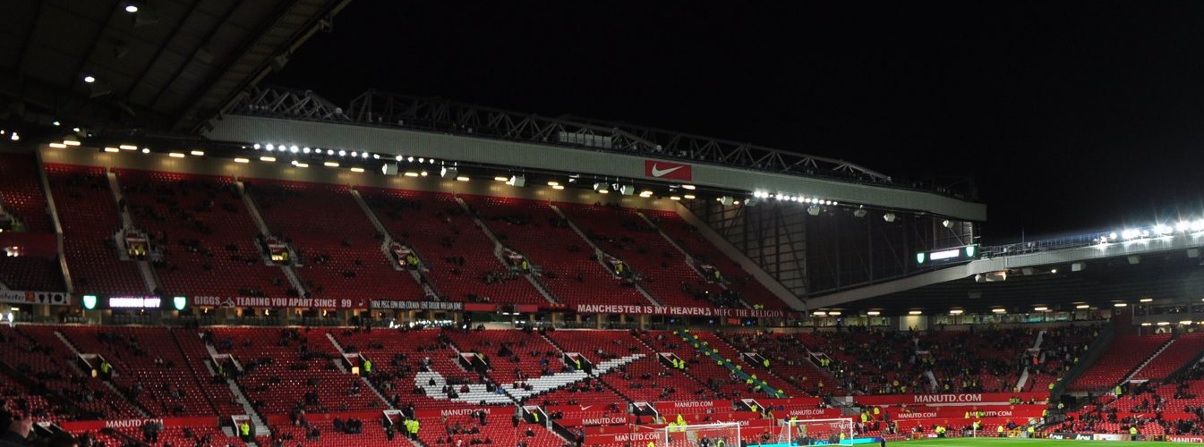 Old Trafford floodlit before a match, part of the Premier League weekend coverage
